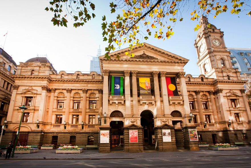 The exterior of Melbourne Town Hall with its columned entrance and clock tower